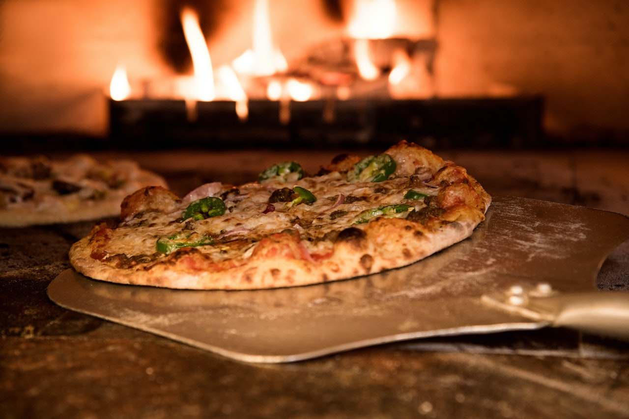 Baked Pizza On Pizza Peel In Oven 905847