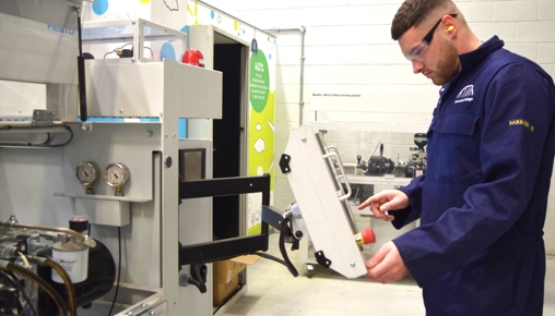 Energy Academy Facilities - Student Using Wind Turbine Machine
